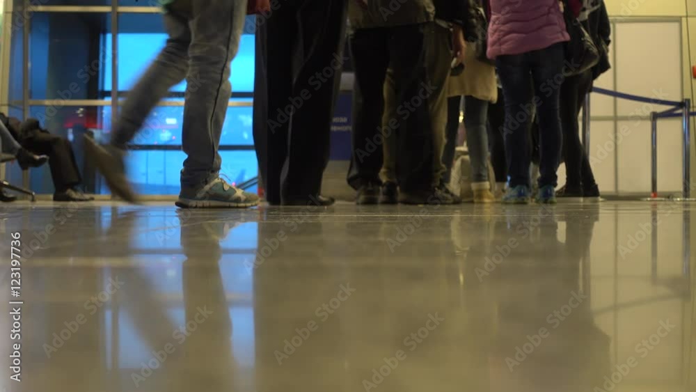 People boarding to the airplane at the gate in airport People boarding to the airplane at the gate in airport