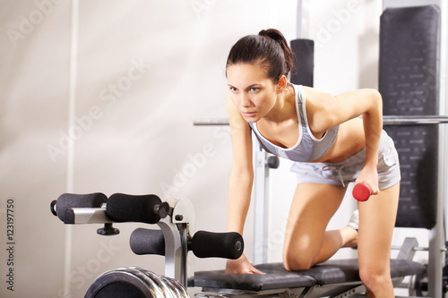 A young girl practicing athletics in gym © pressmaster