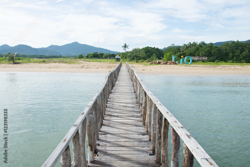 a wooden platform across the beach line, use for crossing to boat to beach upon high tide or low tide