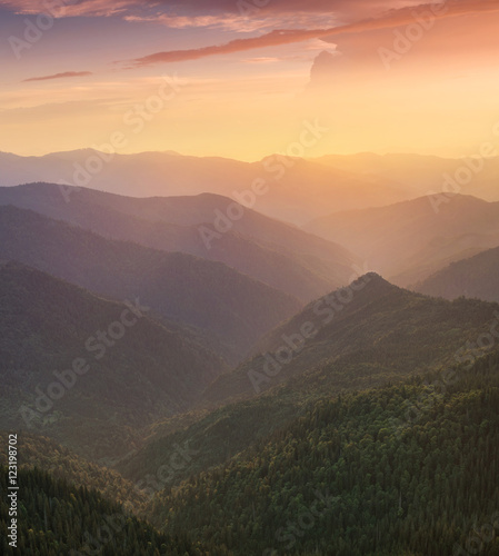 Hills lines in mountain valley during sunset. Natural summer mountain landscape..