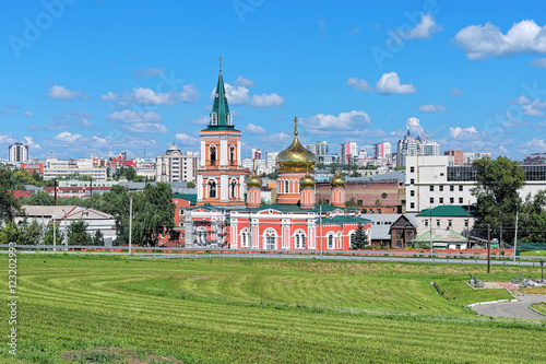 Barnaul, Russia. Znamensky Cathedral (Church of the icon of Our Lady of the Sign) on the background of the central part of the city. photo