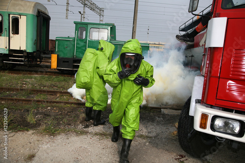 Fotografie firemen in action, Firefighters exercises train accident, chemical contamination