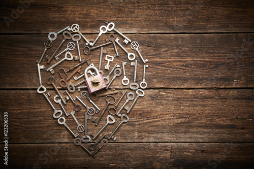 Valentine heart from different old keys with padlock, the concept of love 