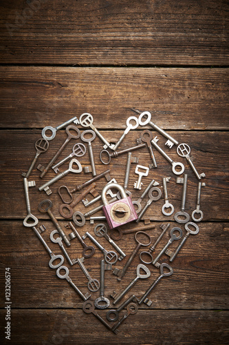 Valentine heart from different old keys with padlock, the concept of love 