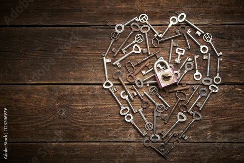 Valentine heart from different old keys with padlock, the concept of love 