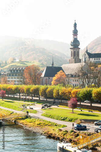 Landscape with town Cochem on river moselle. Fall season.