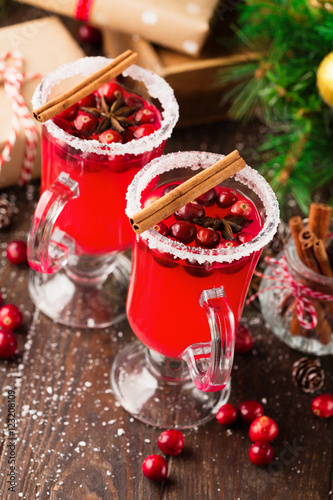 Festive Cranberry drink on Christmas background, holiday time, selective focus, winter concept