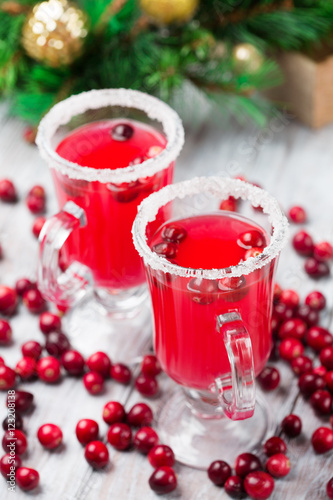 Festive Cranberry drink on Christmas background