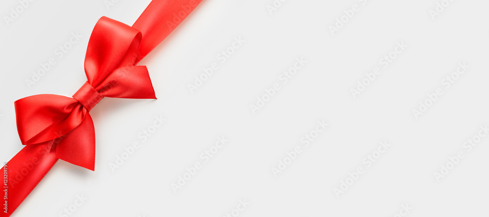red satin bow on white background, whole object is cut with clipping path red satin bow on white background, whole object is cut with clipping path