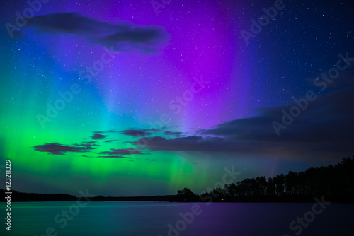 Scenic view of northern lights over calm lake