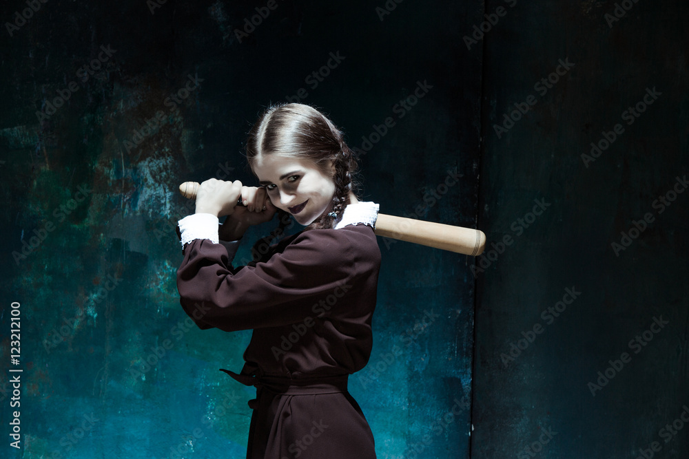 Φωτογραφία Portrait of a young girl in school uniform as killer woman