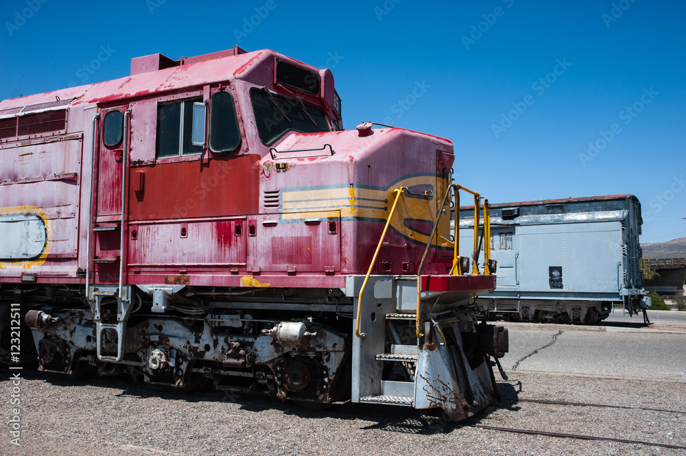 Old grungy abandoned and decaying locomotive parked in a rail yard Old grungy abandoned and decaying locomotive parked in a rail yard