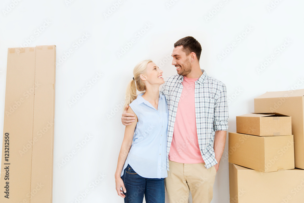 couple with cardboard boxes moving to new home couple with cardboard boxes moving to new home
