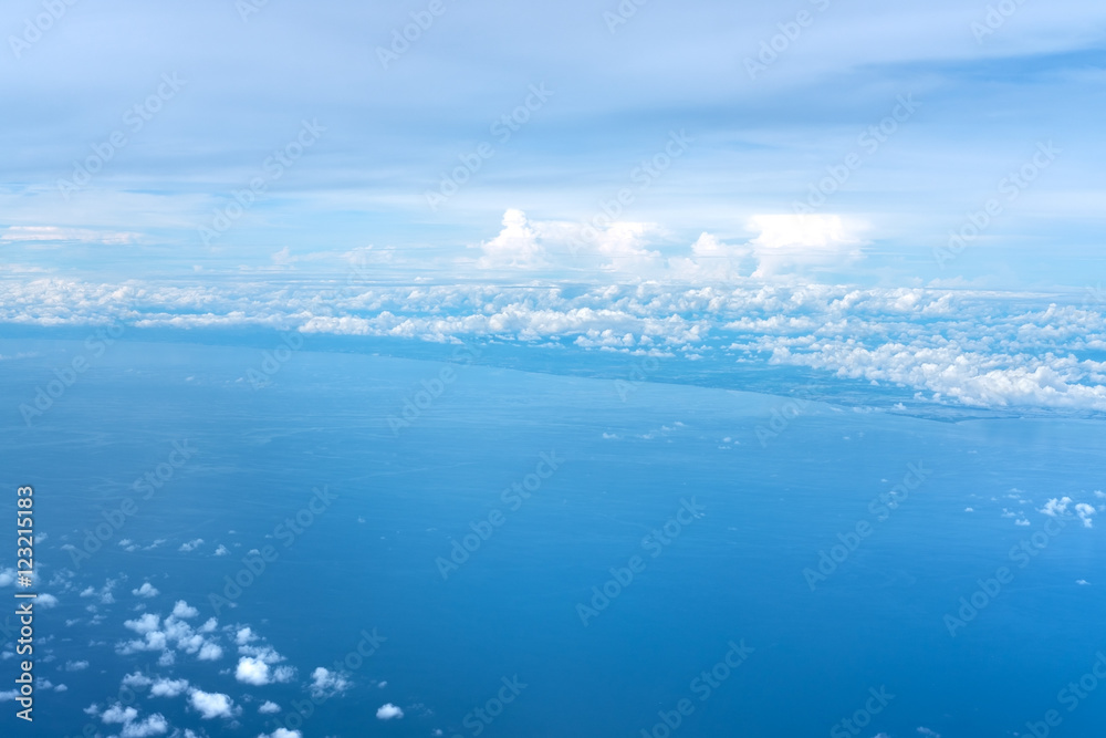 blue sky and ocean view above the Clouds from airplane