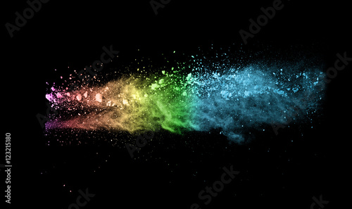 Explosion of colored powder on black background