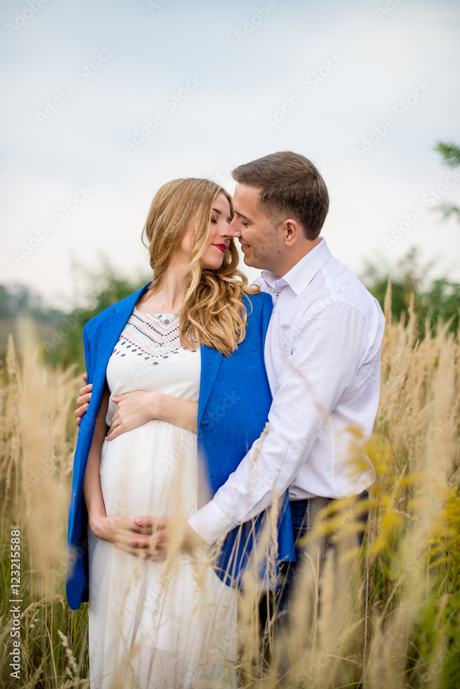 Portrait loving family in anticipation of the baby. Soft and romantic in nature photography