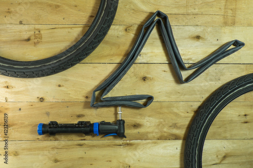 Overhead view of bicycle bicycleBellows Portable on a rustic wooden floor. photo