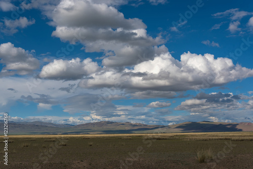 Fototapeta Naklejka Na Ścianę i Meble -  mountains steppe sky clouds