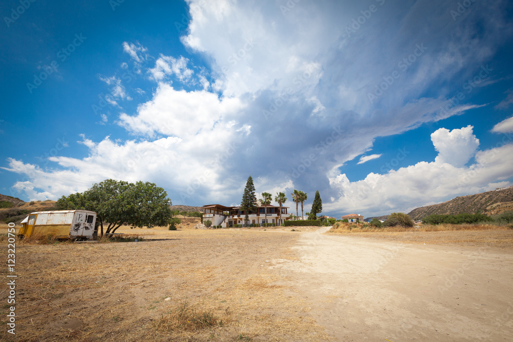 Fototapeta premium Big clouds in the sandy valley