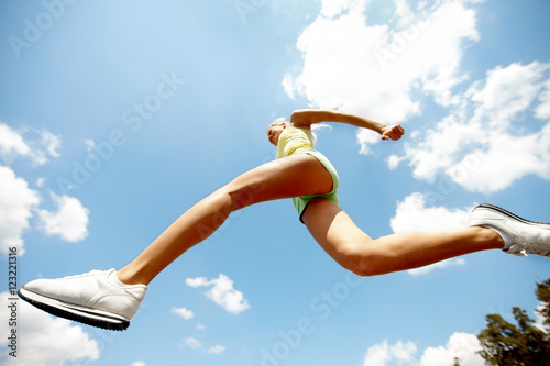 Low angle view of a jumping girl