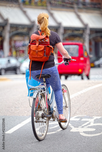 Blonde girl on bike path in Amsterdam
