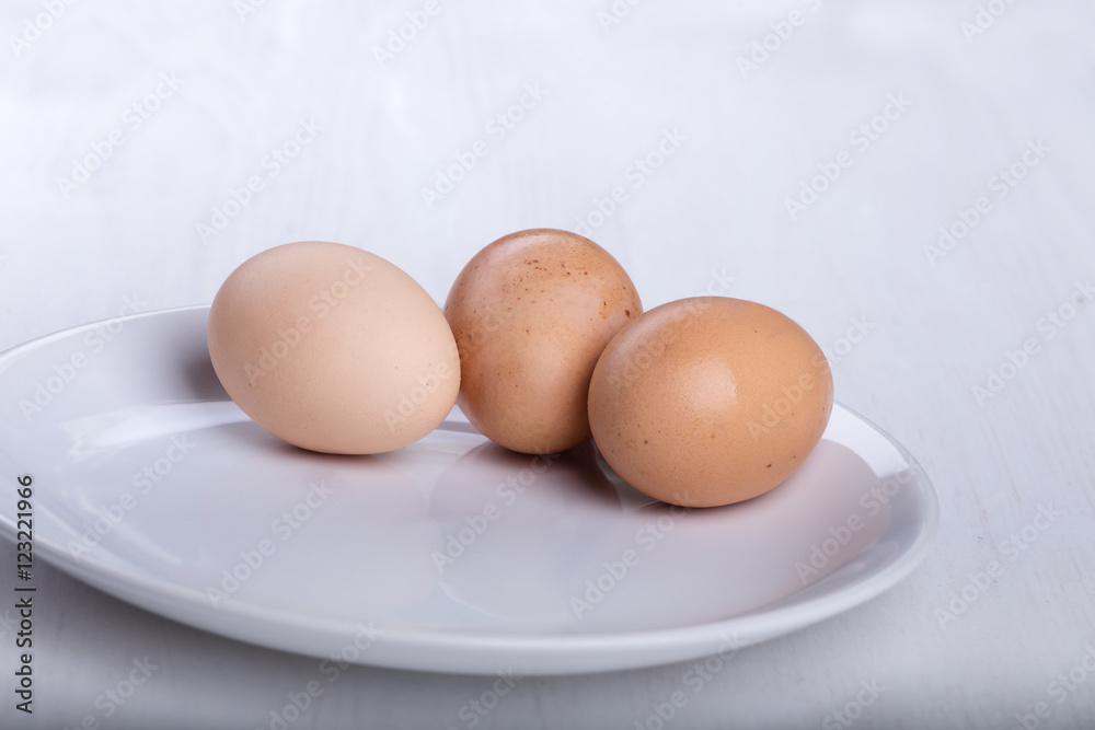 Three raw or boiled chicken eggs
