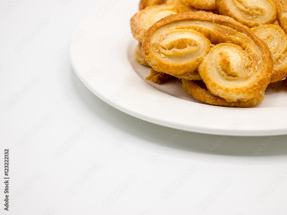 Golden and crisp palmier cookies. Pastry with sugar in a palm shape Golden and crisp palmier cookies. Pastry with sugar in a palm shape