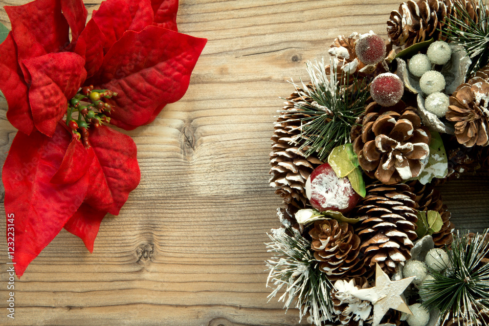 Christmas wreath and branch with red flowers Christmas wreath and branch with red flowers