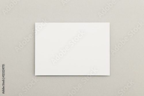 Blank white poster flyer on a grey background photo