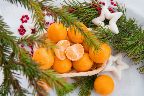 new year decoration with mandarins and fir tree