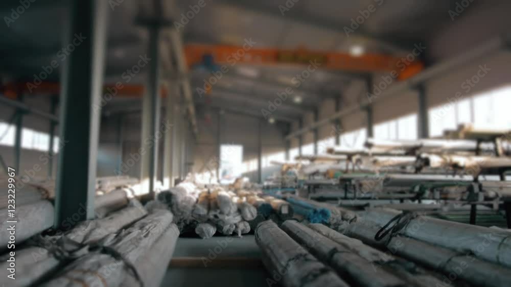 Steel Pipes bunch on the rack in warehouse. Modern stock of Equipment on sunset witj lens frares Steel Pipes bunch on the rack in warehouse. Modern stock of Equipment on sunset witj lens frares
