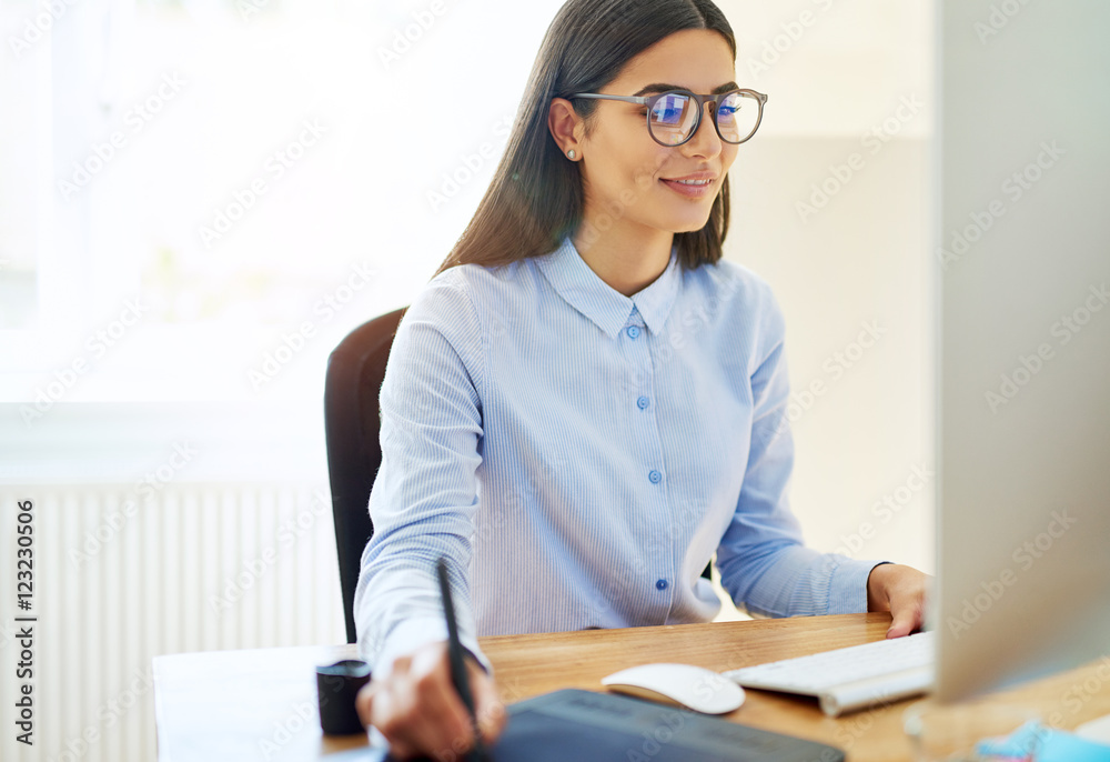 Businesswoman working with a stylus and tablet Businesswoman working with a stylus and tablet