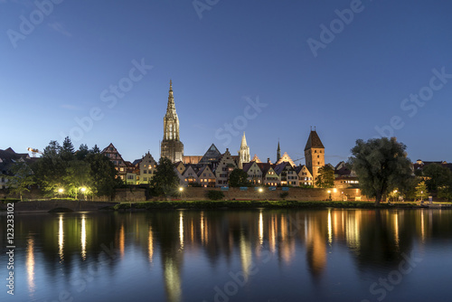 Germany, Ulm, view to the city with Danube River in the foreground at dusk photo