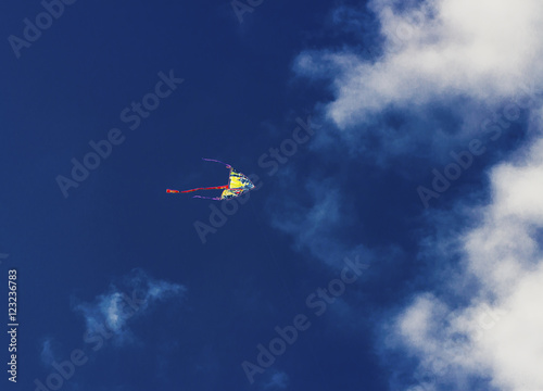 Colorful kite flying in the blue sky