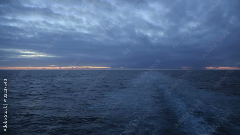 Wake of ship at sunrise, sky and water Wake of ship at sunrise, sky and water