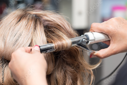 Female Hairstyles on curling in a beauty salon