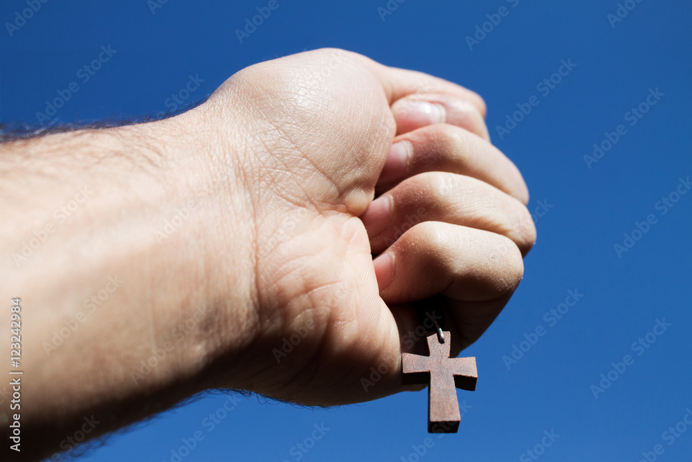 cross and hand StockFoto Adobe Stock