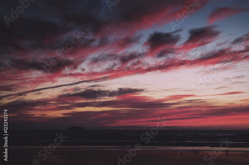 Colourful sunset over the beach at Polzeath Vintage Retro Filter © Christopher Hall