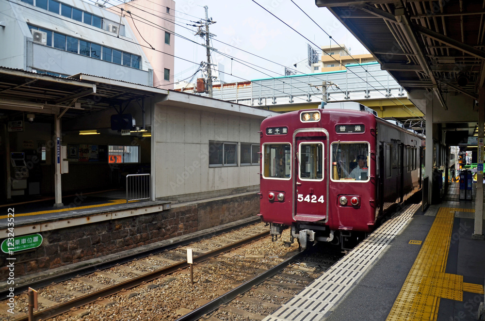 Red classic train of Hankyu kyoto line running from Kyoto statio