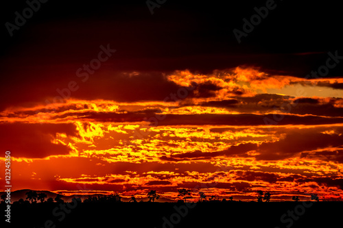 The sky is on fire Burning orange and red clouds during the sunset in the Trakia region in Bugaria