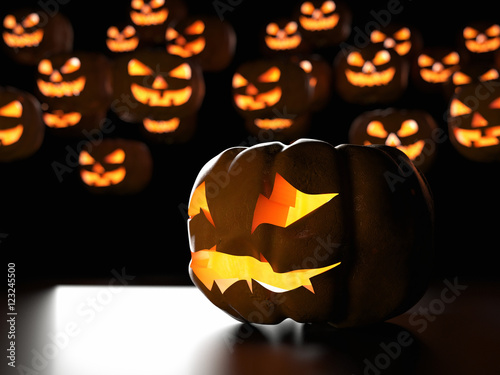 Group of spooky Halloween Jack o Lanterns with light from a candle inside. Sinister evil pumpkins for hallowe'en holiday theme. 3d illustration with selective focus and blurred background