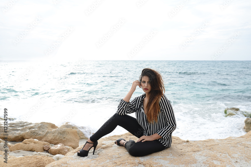 beautiful girl with striped shirt on the beach