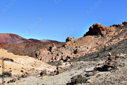 The uninhabited part of the giant mountain valley with rocks and dry plants
