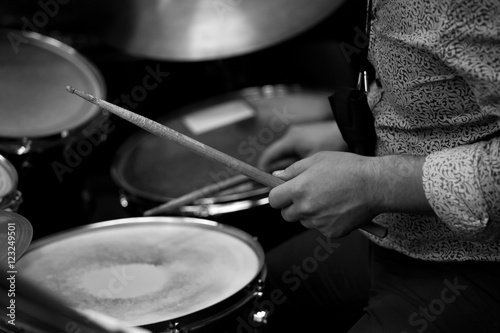 Hand girl holding a violin in the orchestra closeup in black and white