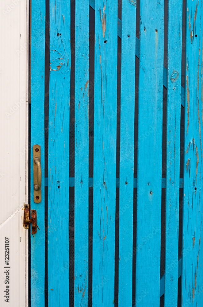 wicket door with a handle made of boards turquoise wicket door with a handle made of boards turquoise