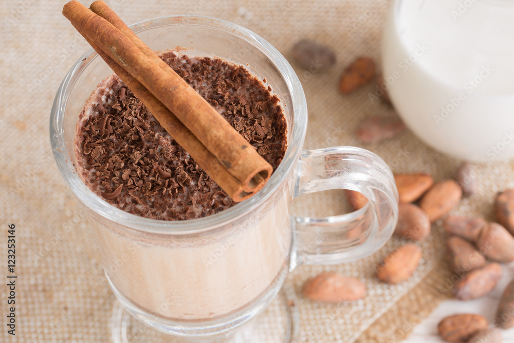 Fresh Made Chocolate Banana Smoothie on a wooden table with coffee and spices. Milkshake. Protein diet. Healthy food concept. Drink, cocoa beans, chocolate. Fresh Made Chocolate Banana Smoothie on a wooden table with coffee and spices. Milkshake. Protein diet. Healthy food concept. Drink, cocoa beans, chocolate.