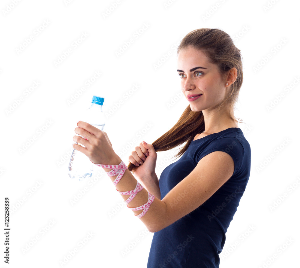Woman with centimeter holding a bottle of water Woman with centimeter holding a bottle of water