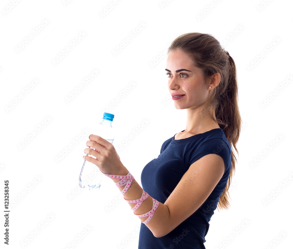 Woman with centimeter holding a bottle of water Woman with centimeter holding a bottle of water