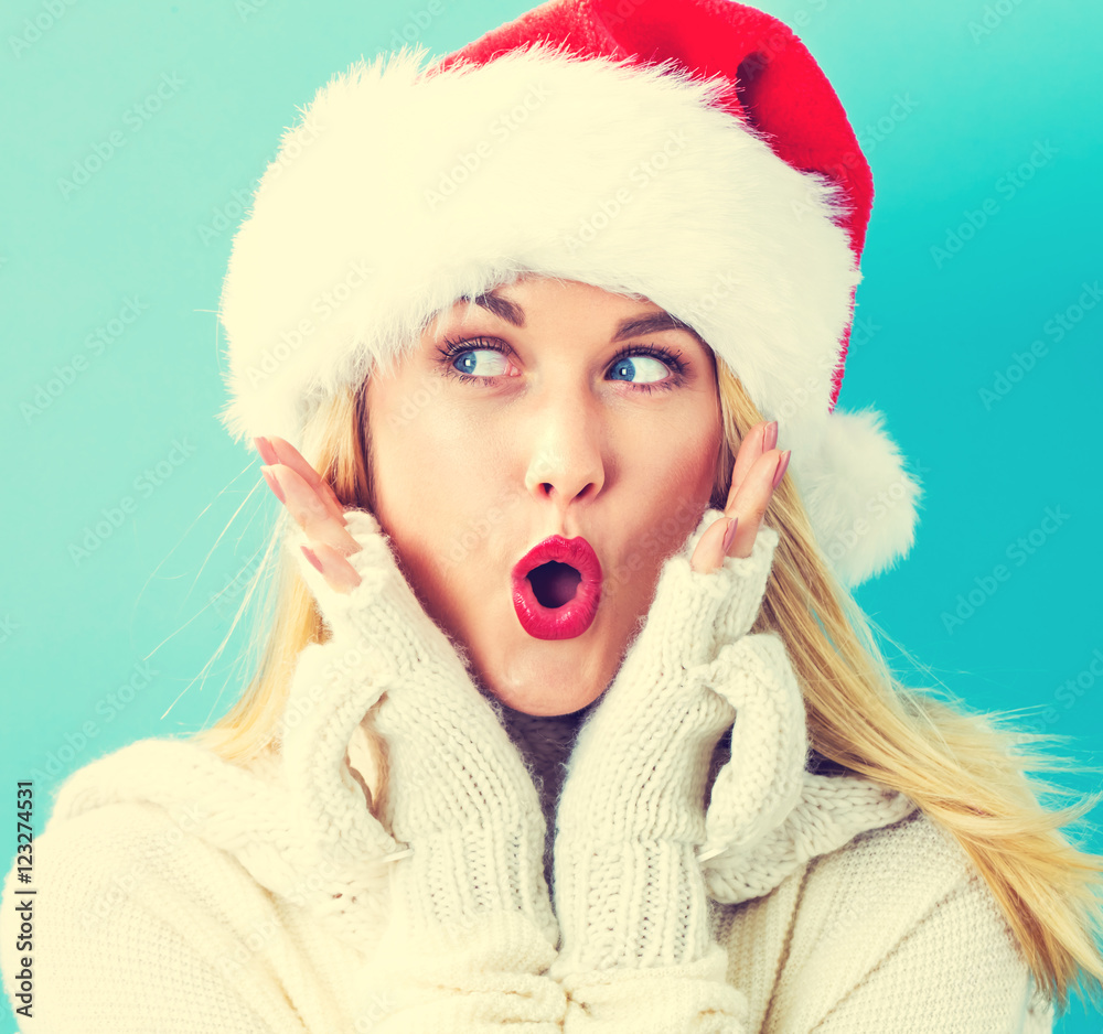 Happy young woman with Santa hat Happy young woman with Santa hat