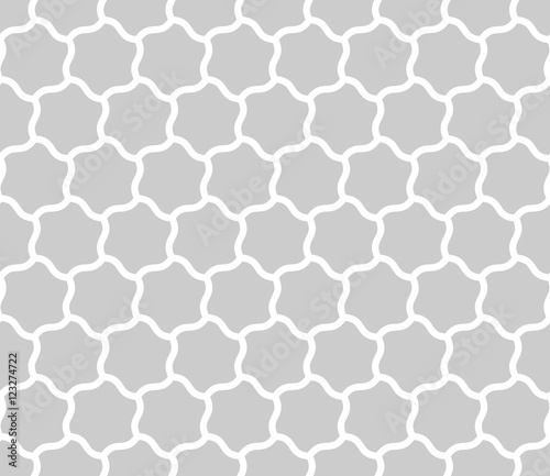 Seamless background of curved hexagons. Looks like puzzle od stars. Simple abstract pattern vector background in grey with white outline.